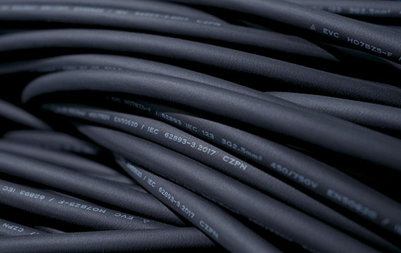 Close-up of multiple BESEN electric vehicle charging cables coiled together, showcasing the product's rigorous quality control.