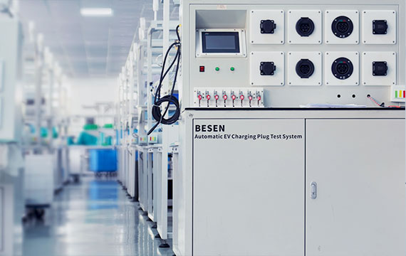 A BESEN automatic EV charging plug test system in a well-lit, organized factory, highlighting over 14 years of manufacturing experience.