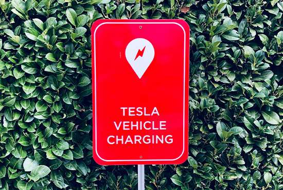 Red sign with a lightning bolt icon and the words