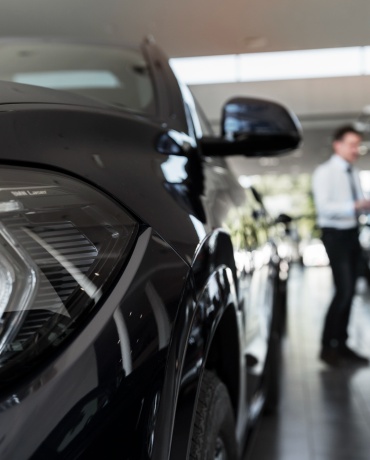 Auto dealership environment with electric vehicles, showing where BESEN SQW45 EV charging stations can be installed for customer convenience.