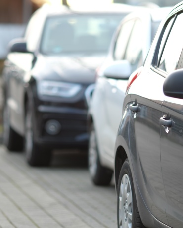 Fleet management facility with vehicles, illustrating where BESEN SQW45 EV charging stations can be installed to charge company fleet vehicles.