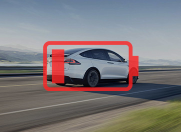 Electric vehicle on a highway with a red emergency highlight, showcasing the BESEN 40-amp portable EV charger's role as a backup charging solution during unexpected battery depletion.