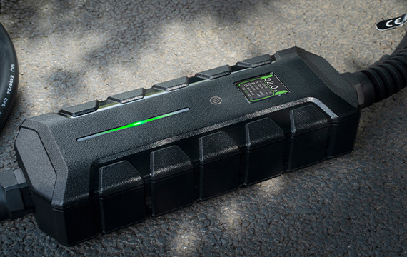 BESEN SQP400 charger placed on the ground with an illuminated green LED strip and LCD screen, showcasing its efficient and reliable charging features.